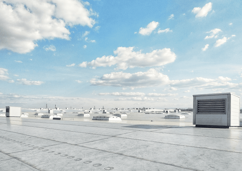 Industrial rooftop with cloudy sky view