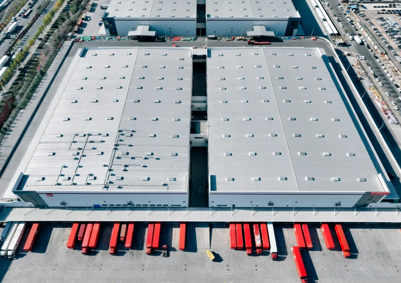 Large warehouse and transport trucks overview